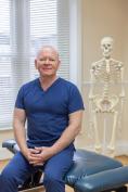 Kevin with Skeleton Dr Kevin Loughlin Chiropractor Hemel Hempstead